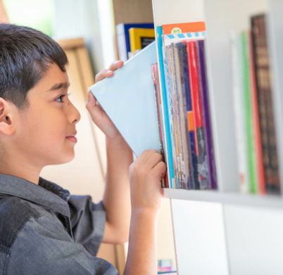 children grab book on shelf in library room at school spot focus on the eye