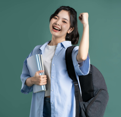 Portrait of a beautiful Asian student on a green background